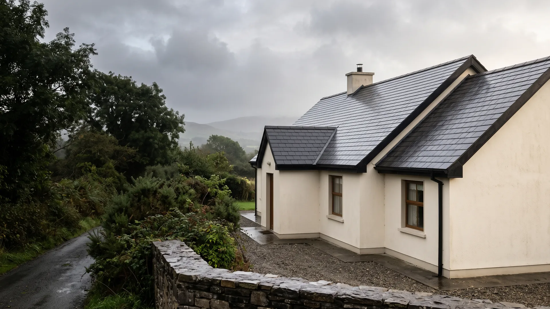 Illustrative Irish home with a slate roof, cream walls and mature planting
